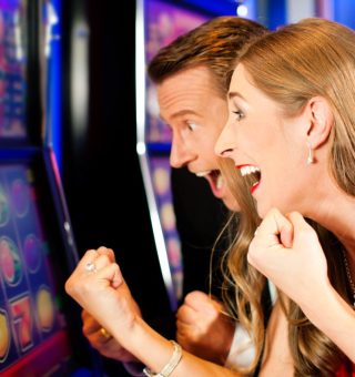 Couple in Casino Couple in Casino on a slot machine